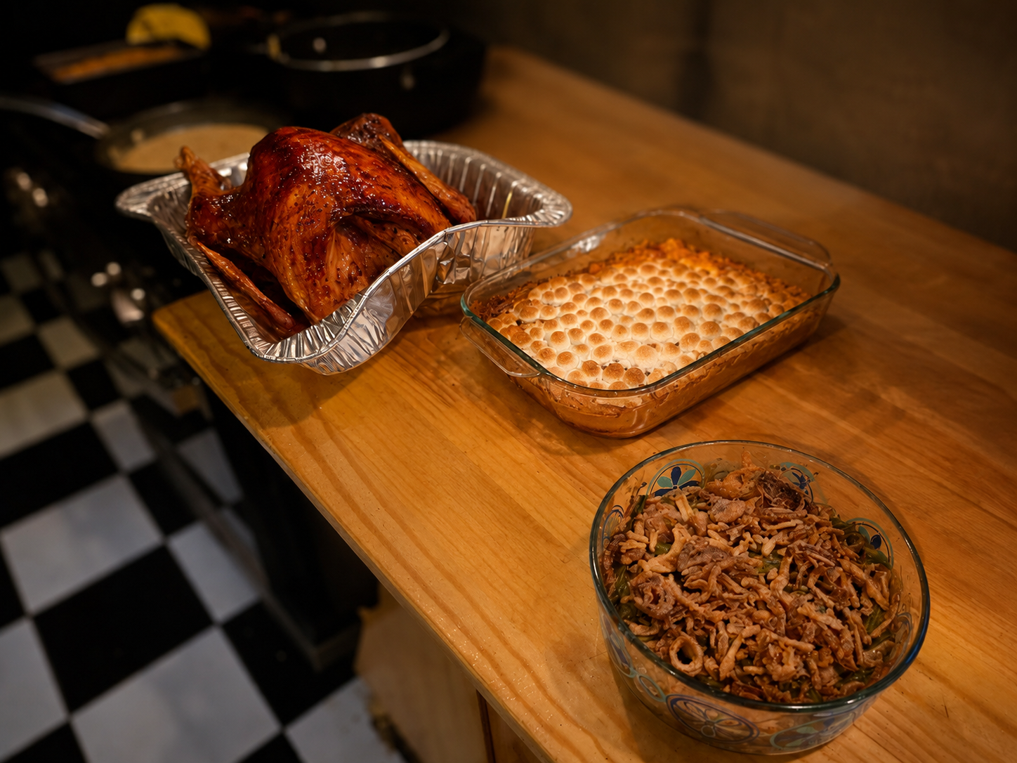 A catered spread of roast turkey with sweet potato and green bean casseroles